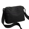 Black floral canvas tote bag with multiple pockets and a shoulder strap