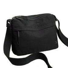 Black floral canvas tote bag with multiple pockets and a shoulder strap