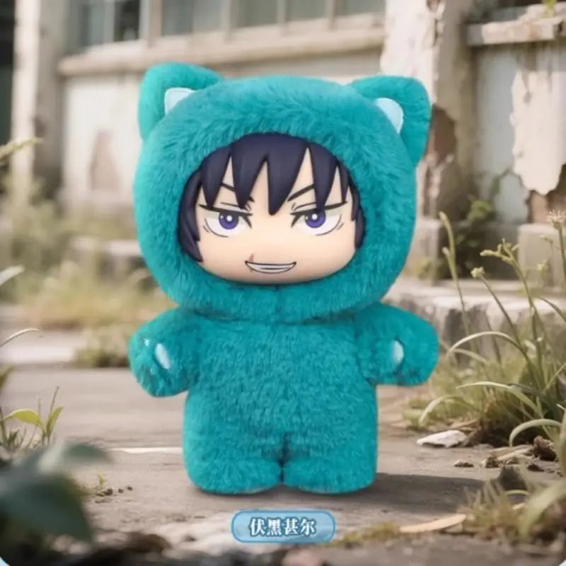 A plush collectible figure of Gojo Satoru wearing a teal hoodie with black hair, displayed outdoors.