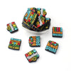 A collection of black and yellow silicone bingo beads and tiles for DIY jewelry and accessories.