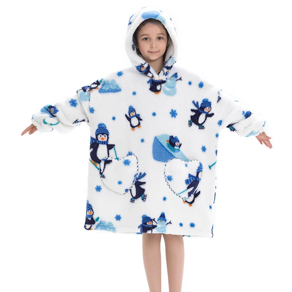 A young girl wearing a white flannel hoodie sweater with blue and white animal print patterns.