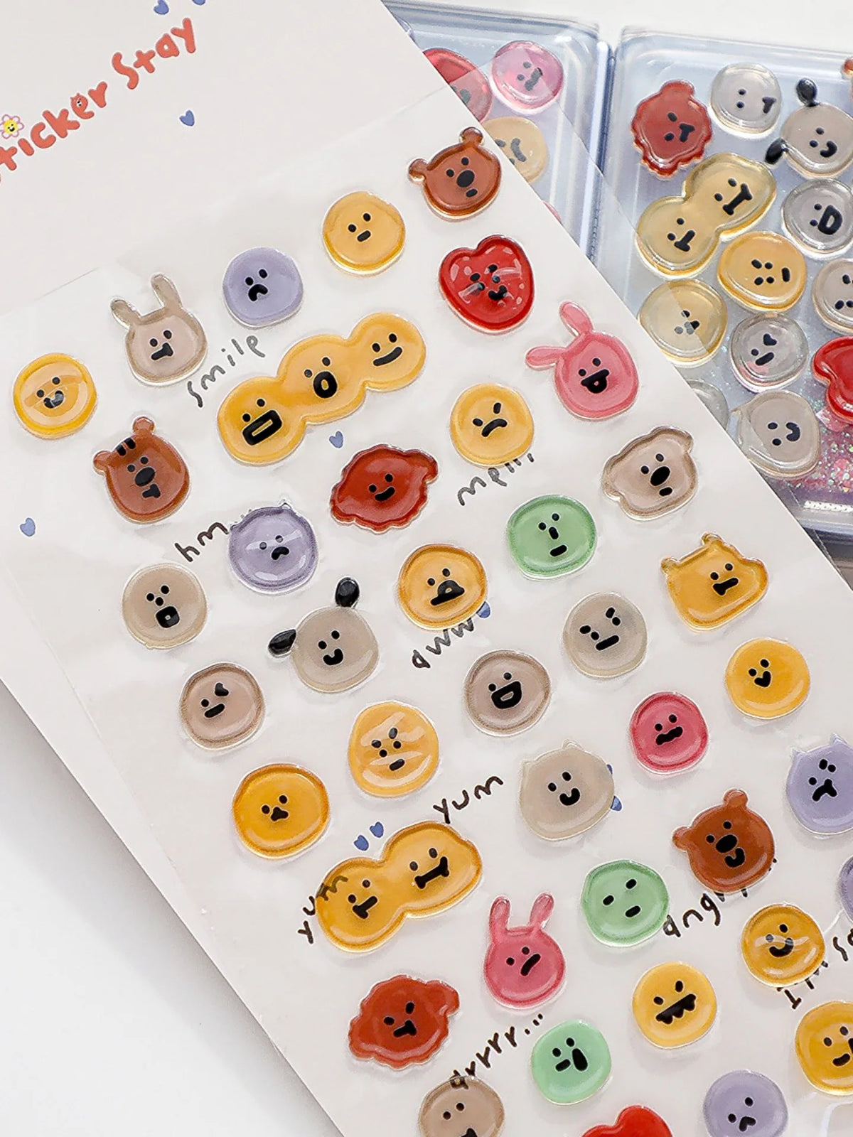 A collection of 3D smile face crystal stickers in various colors and shapes for crafting and decorating.