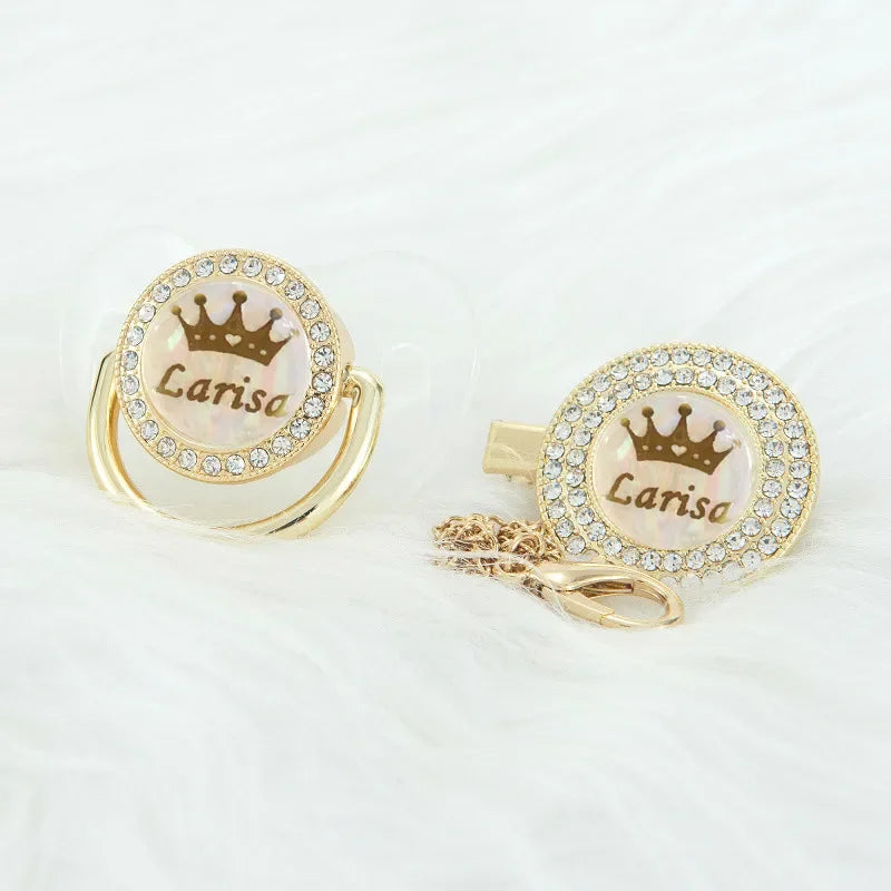 Personalized rose gold crown pacifier and clip set featuring a pearl and diamond design