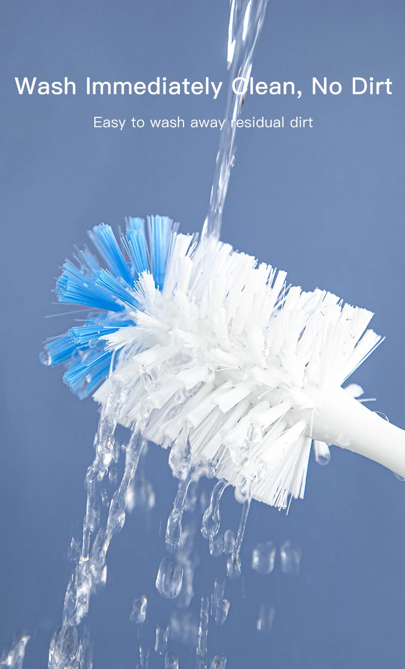 A white and blue cleaning brush is shown under running water, demonstrating its ability to wash away dirt.