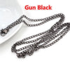 Black gun-style chain connector for jewelry making displayed on a white surface.