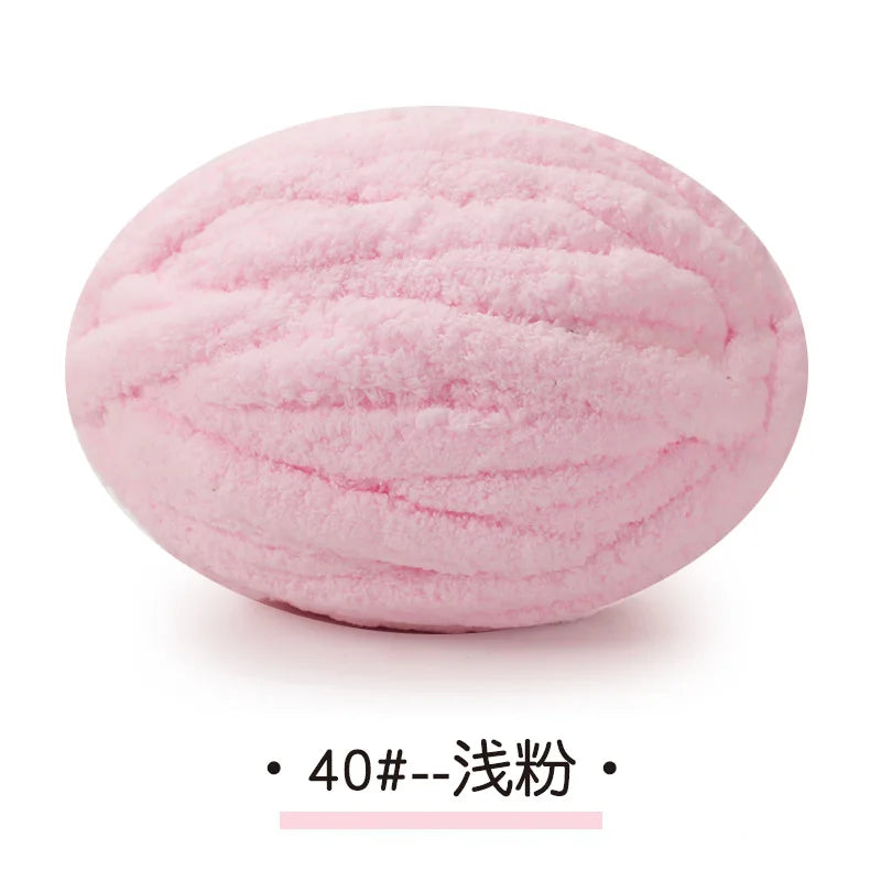 Pink chunky chenille yarn ball used for hand knitting projects