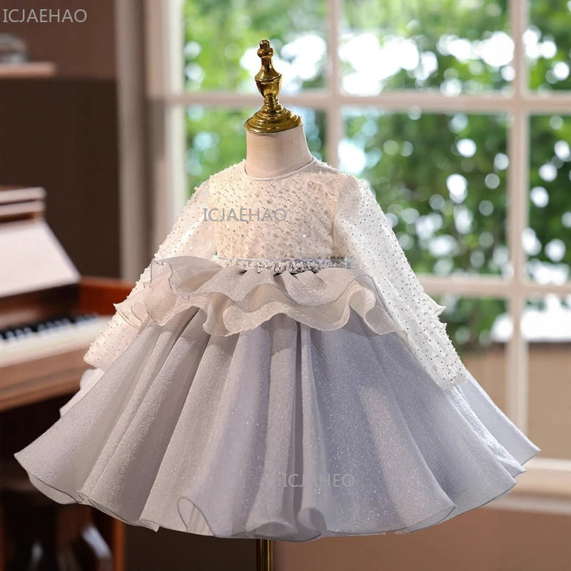 A white and light blue tulle princess dress displayed on a mannequin.