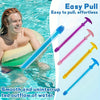 A man floating in water with a colorful, easy-pull water spray toy set featuring four different colored nozzles.