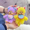 A hand holds two fluffy plush cartoon characters, one purple and one yellow, resembling a kawaii charm.