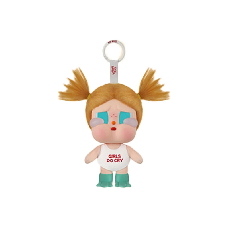 A vinyl figure of a girl with orange hair and blue eyes wearing a white top, labeled Girls Do Cry.