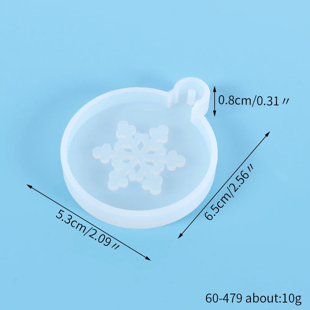 A clear silicone mold with a festive Christmas snowflake design used for jewelry and craft projects.