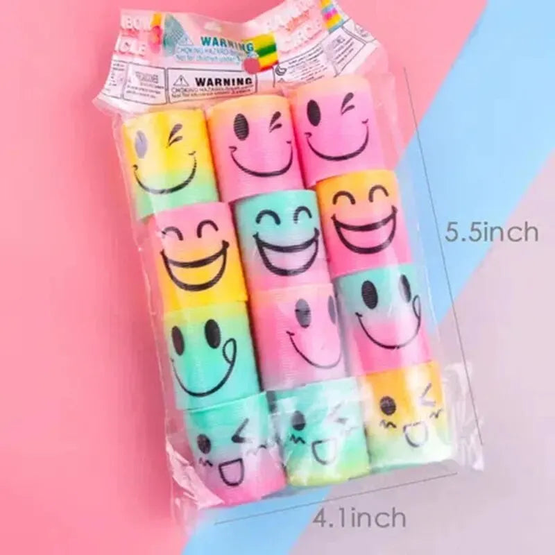 A clear plastic bag containing twelve colorful smiling face stacking circles for play.