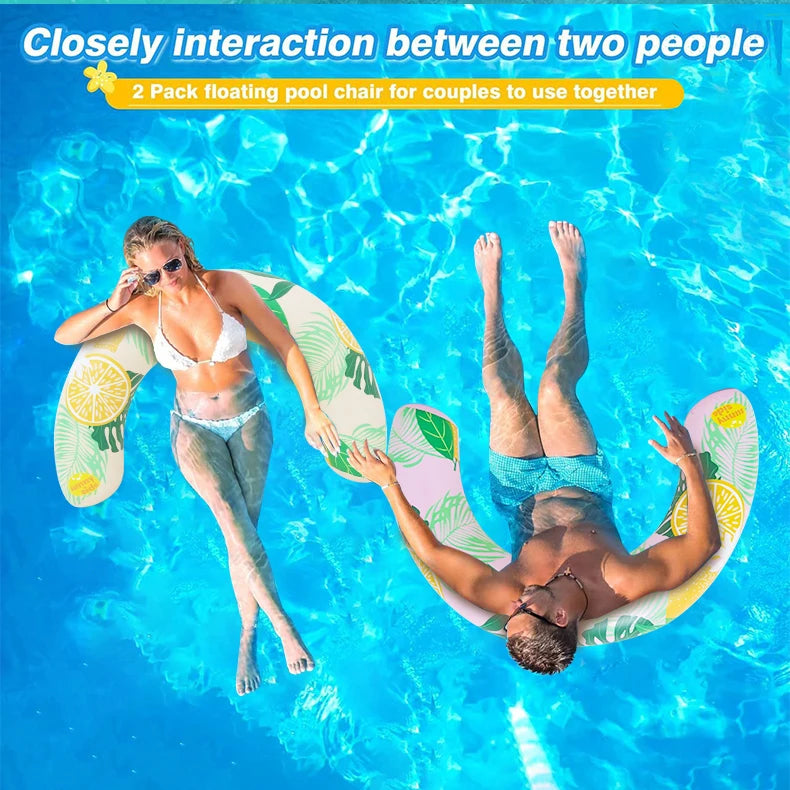 Two people floating in water using a pair of yellow and green inflatable pool chairs for couples