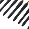 A set of eight black ergonomic crochet hooks with varying sizes and soft grips.