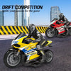 A yellow and black racing motorcycle is featured in a drift competition setting with a rider and background buildings.
