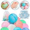 A collection of colorful reusable water balloons in various shades including blue, pink, green, and white.