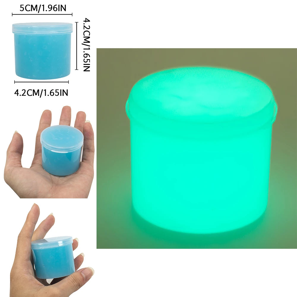 A small, translucent blue slime container with a glowing cyan light, shown next to a hand for scale.