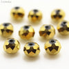A collection of round, gold-colored crystal glass beads used for jewelry making.
