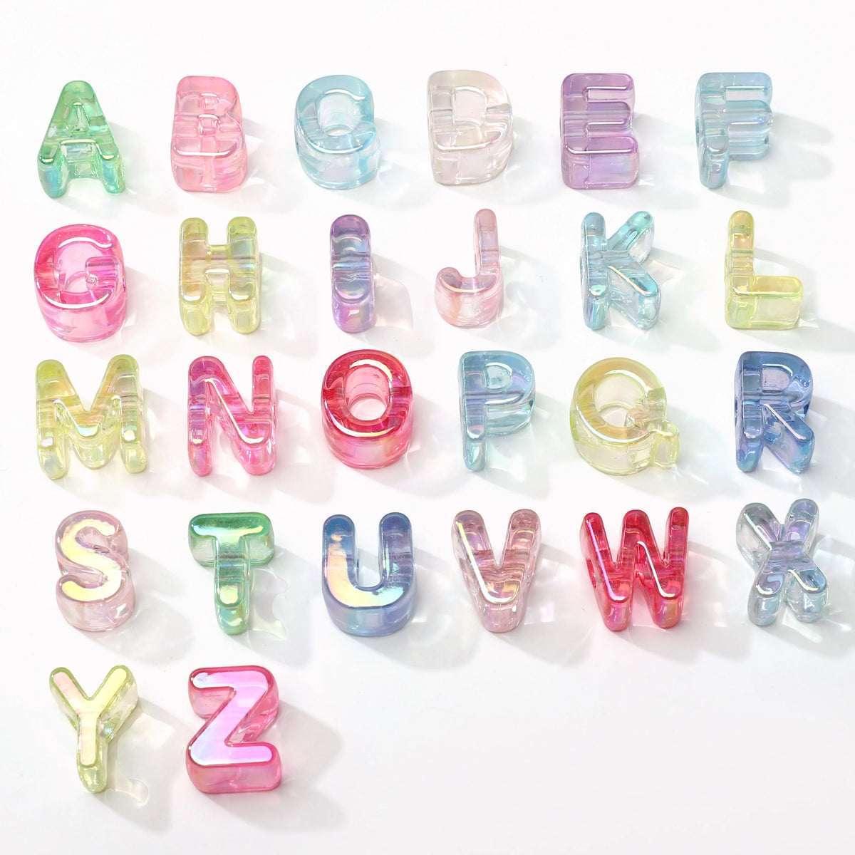 A collection of colorful acrylic alphabet beads in various shades and sizes for jewelry making