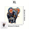 An XL wooden jigsaw puzzle featuring an elephant with colorful floral decorations.