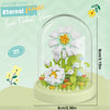 A clear glass dome display of a DIY flower bouquet made from white and yellow building blocks.