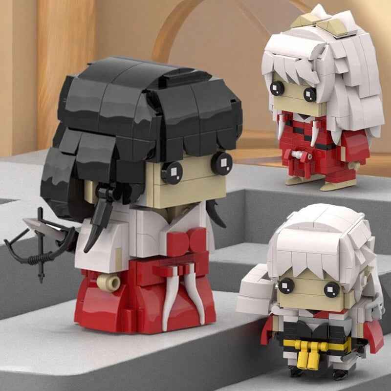 A set of anime-inspired collectible building block figures featuring characters with black hair and red clothing.