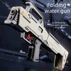 A folding water gun is shown in a close-up, angled view against a dark background.