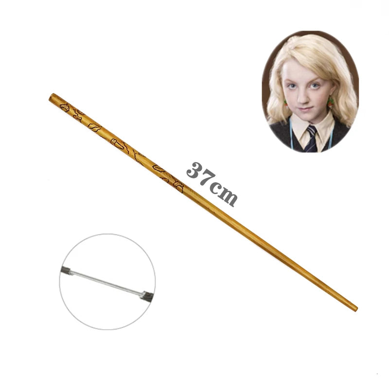 A long, slender gold-colored metal magic wand with decorative markings and a circular inset photo of a blonde woman.