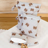 A set of three waterproof wet and dry bags featuring a brown bear pattern, displayed on a white cloth.