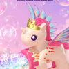 A cute unicorn toy is shown spraying colorful lights and bubbles in a clear bottle against a pink background.