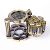 A set of revolver-shaped metal dice used for RPG games, featuring brass and dark metal components.