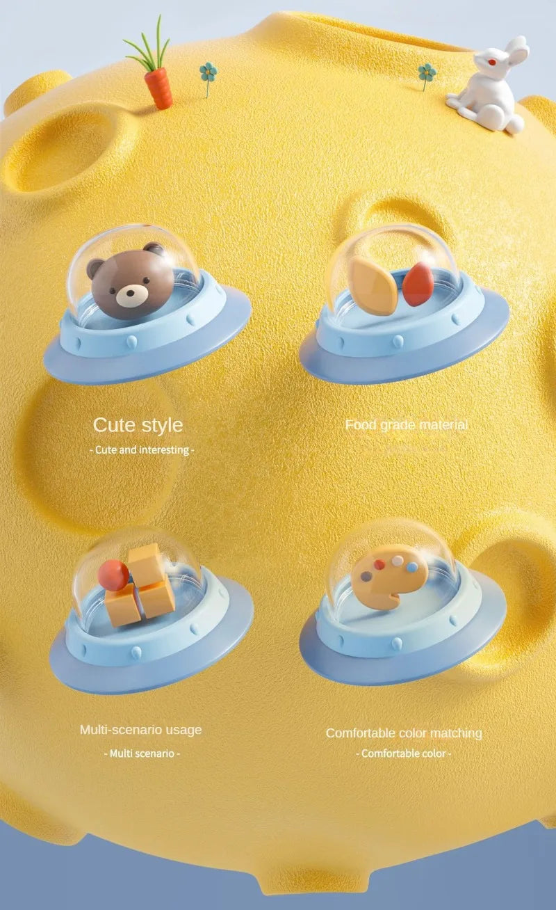 A yellow suction cup spinner bath toy set featuring three cute animal designs for babies.