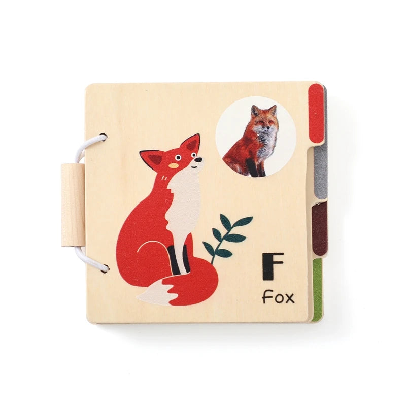 A wooden flap book featuring a red fox illustration on a light wood background.