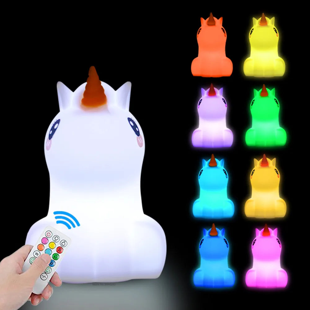 A white koala LED night light is shown with its remote control and multiple colored light options.