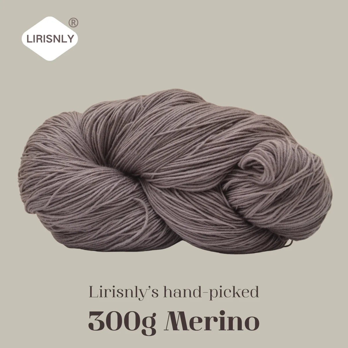 A ball of grey Merino wool yarn labeled as Lirisnly's hand-picked 300g Merino.