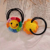Handmade crochet sunflower decorative smile orb with bright yellow and orange petals