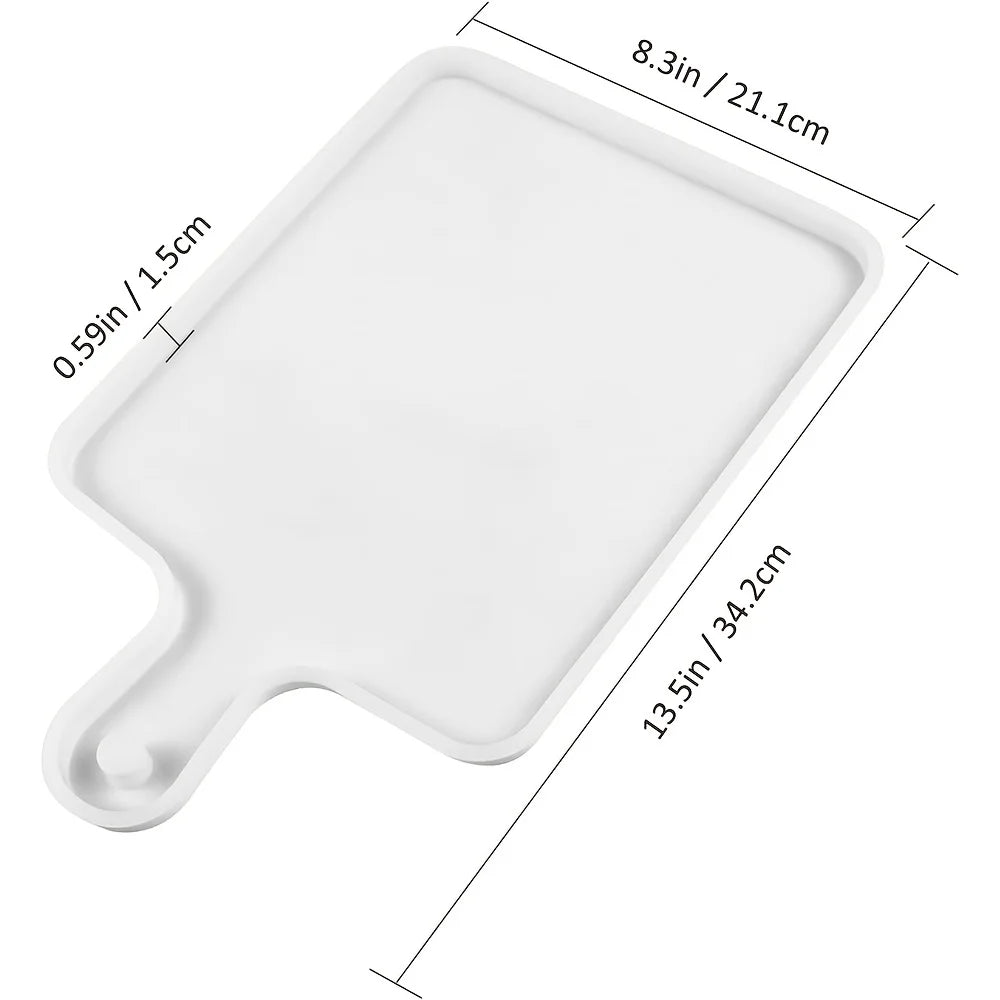 A white flexible silicone resin casting mold with a rectangular base and a curved handle.