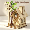 A wooden model kit of a solar clock house featuring a house structure and a windmill.