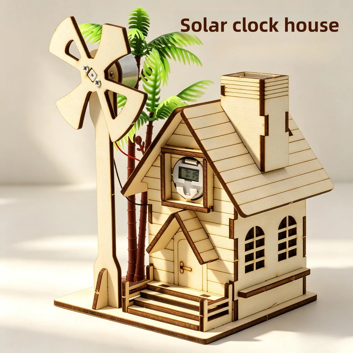 A wooden model kit of a solar clock house featuring a house structure and a windmill.