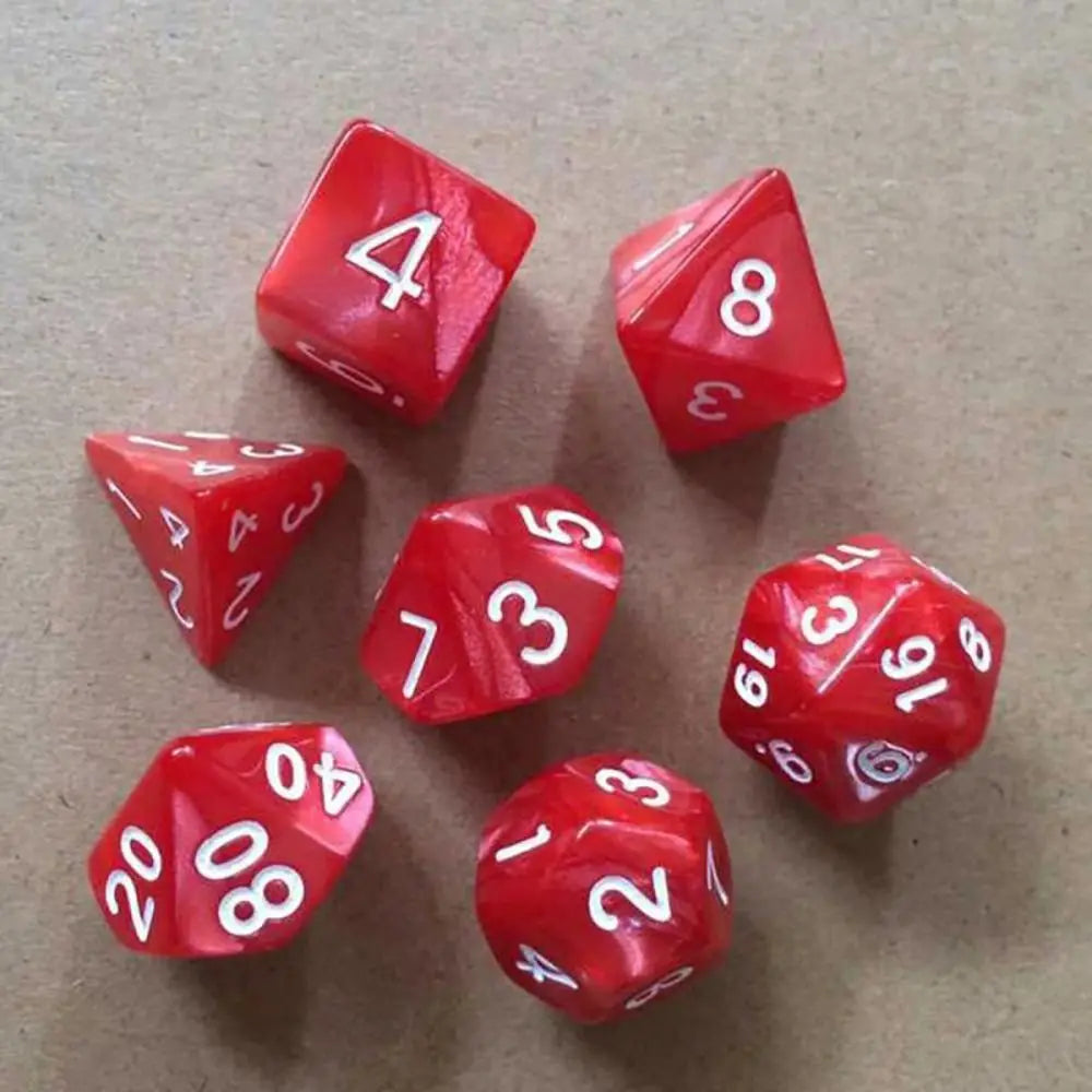 A collection of ten red acrylic polyhedral dice showing various numbers and shapes on a brown surface.