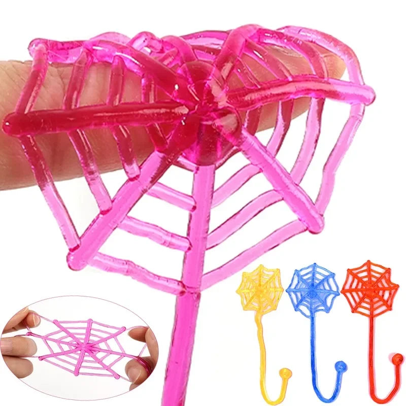 Pink stretchy sticky climbing spider web toy set with a long stick and various colored webs
