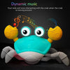 A bright blue interactive music crab toy with large eyes and claws is shown against a dark background.