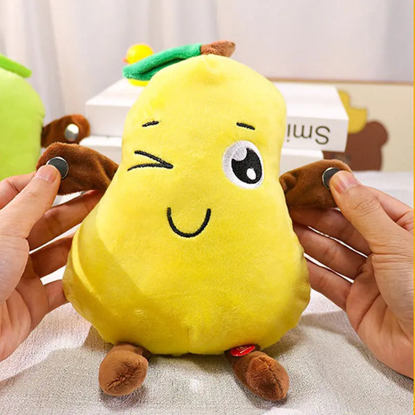 A yellow plush toy shaped like a lemon with large eyes and small feet is being held by a person.