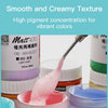 A pink paint is being applied with a brush onto a white container, demonstrating a smooth and creamy texture.