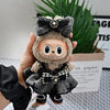 A handmade flannel outfit for a 17cm Labubu doll featuring black and gray fabric with a floral bow.
