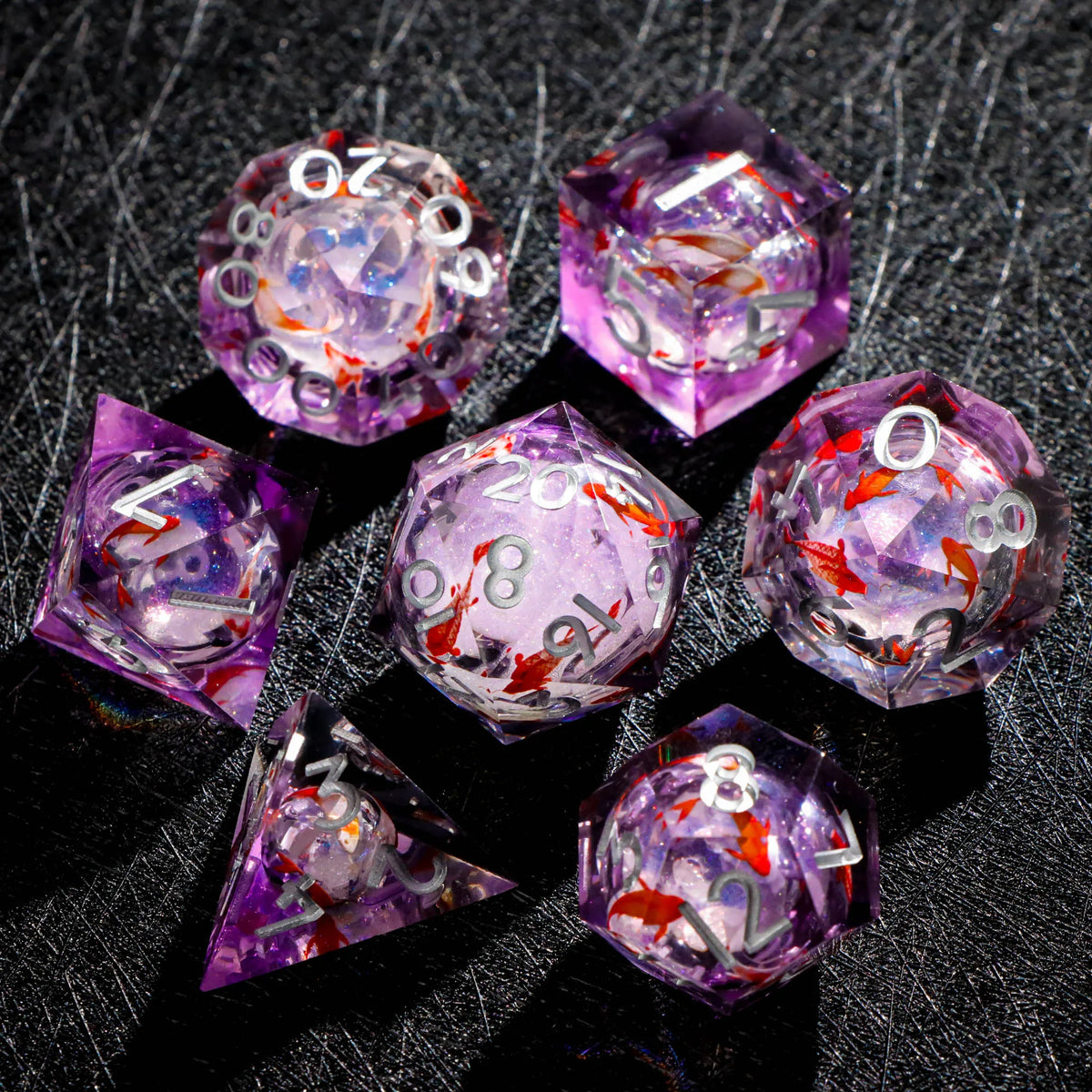 A collection of eight translucent purple resin dice with galaxy sharp edge patterns displayed on a dark surface.