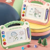 Two pink and green magnetic doodle drawing boards for kids with colorful magnetic tools and small evergreen trees.