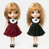 A pair of vintage lace maid dress sets for 1/6 scale dolls, featuring a maroon and black dress with white lace collar.