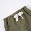 Olive green knit shorts with a white tie detail