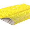 Yellow sparkling rhinestone adhesive tape rolled up for DIY crafts and decor